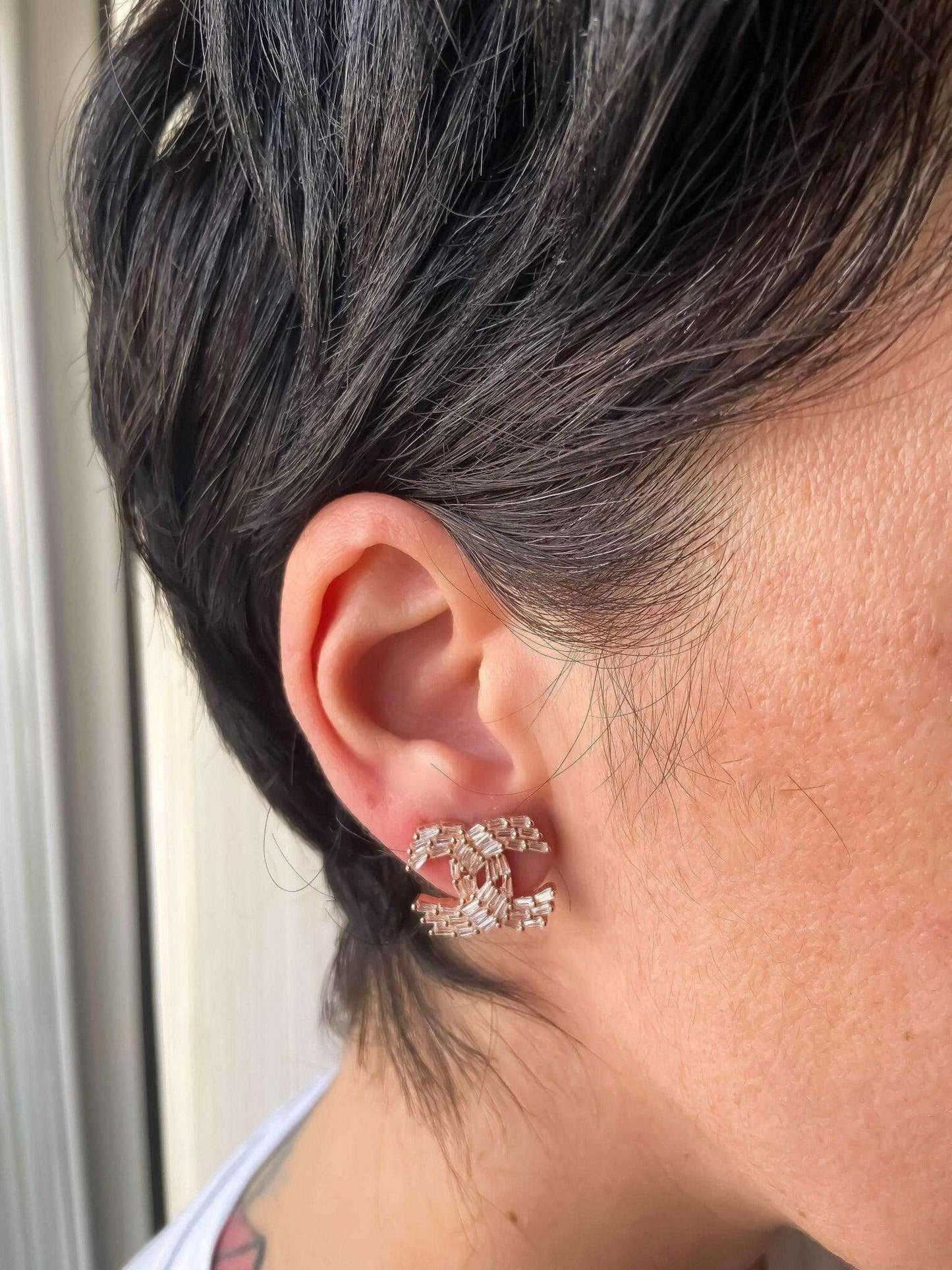 Chanel Rose Gold stud earrings with baguette stones worn on ear