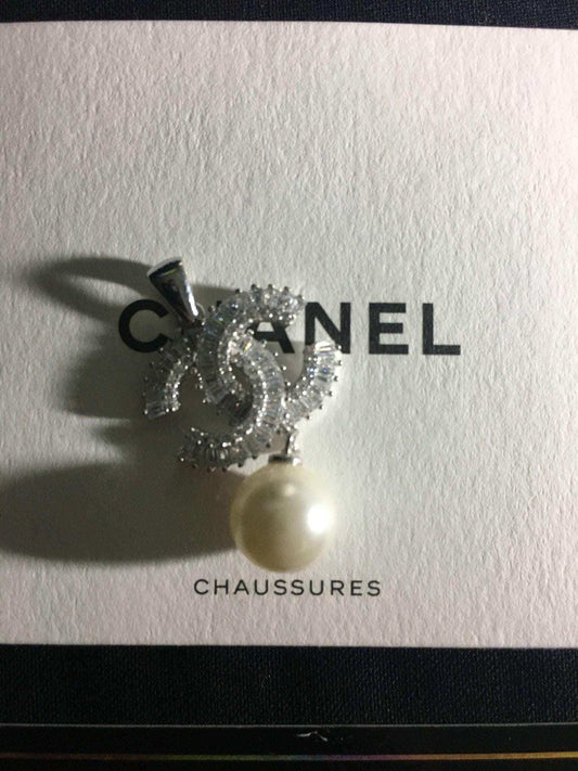 Authentic Chanel Jewelry 925 sterling silver necklace with baguette stones and pearl pendant on Chanel box