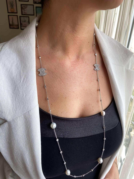 Chanel authentic real pearl necklace with sterling silver and baguette stones worn on neck