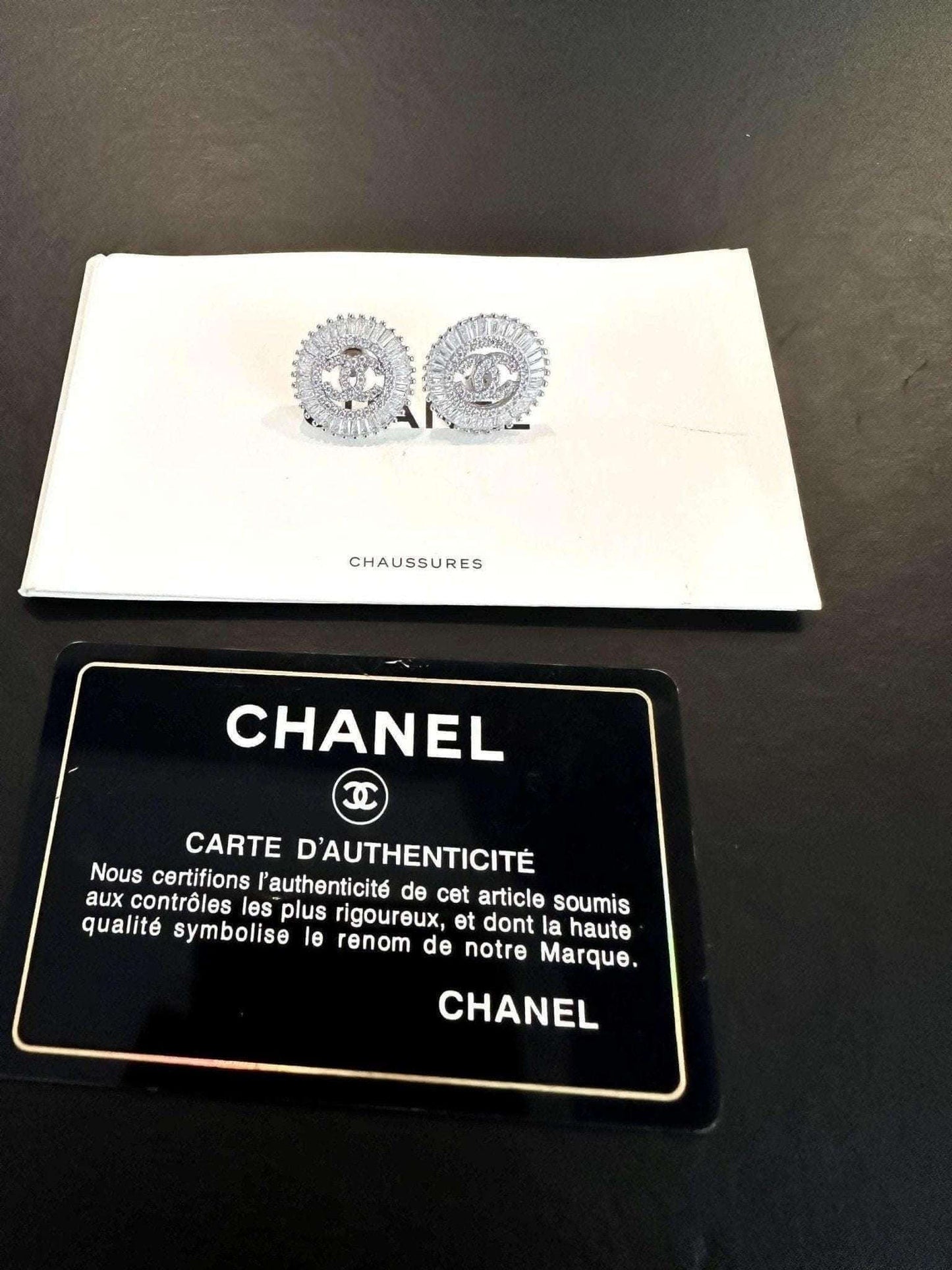 Authentic Chanel Jewelry 925 sterling silver earrings with baguette stones and certification card