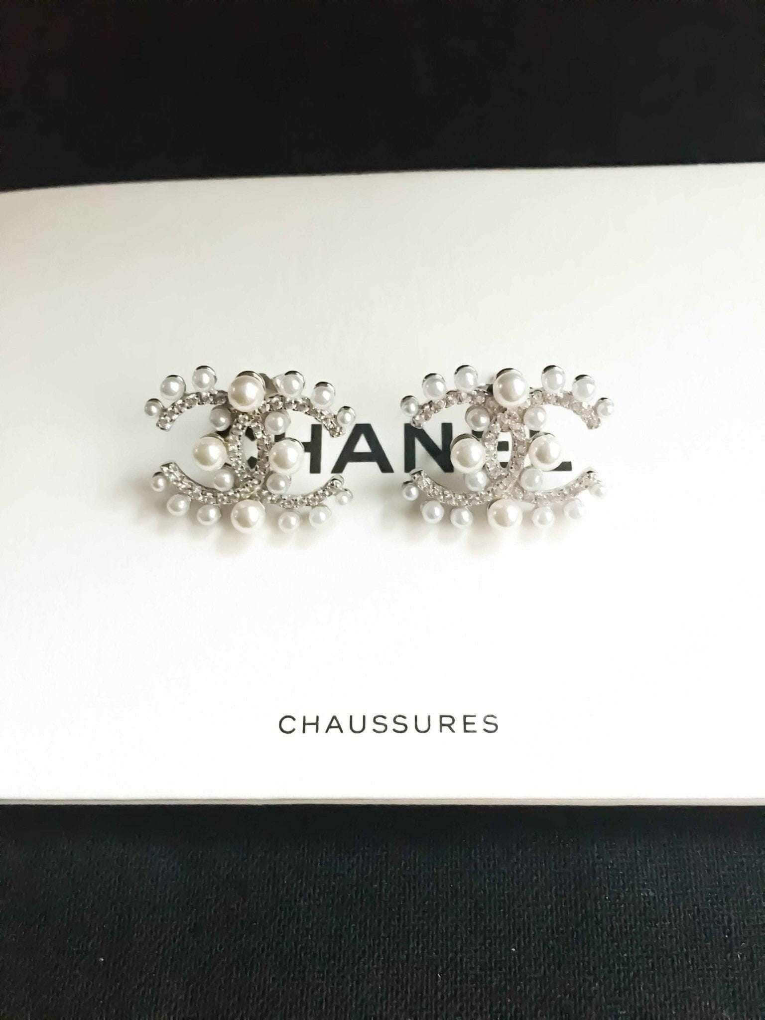 Authentic Chanel Pearl stud earrings in 925 sterling silver with rose gold and imported Italian stones