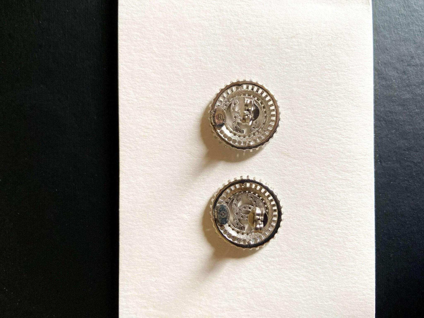 Authentic Chanel Jewelry 925 sterling silver earrings with baguette stones and detailed craftsmanship