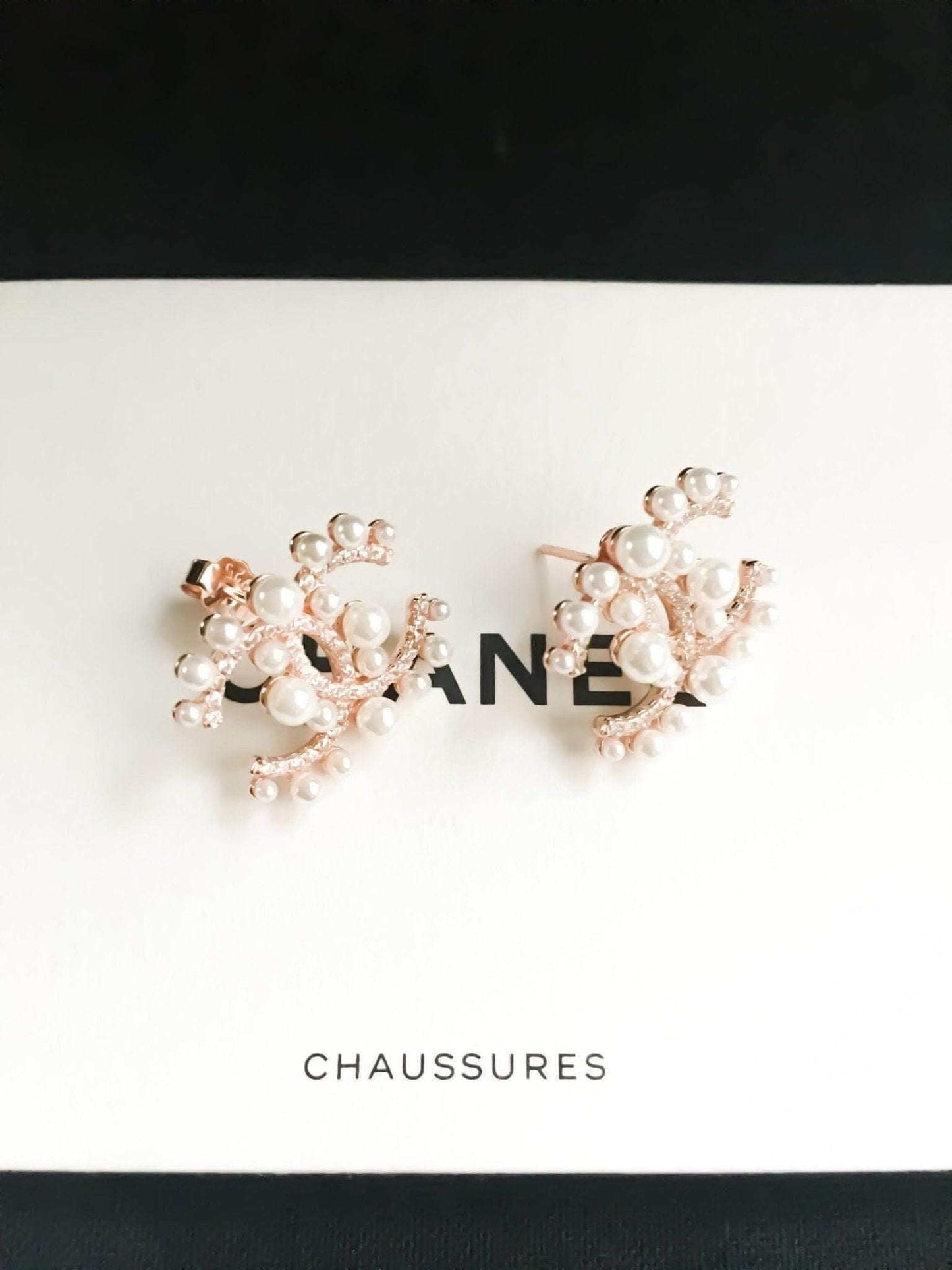 Authentic Chanel pearl stud earrings in 925 sterling silver with rose gold accents and Italian stones