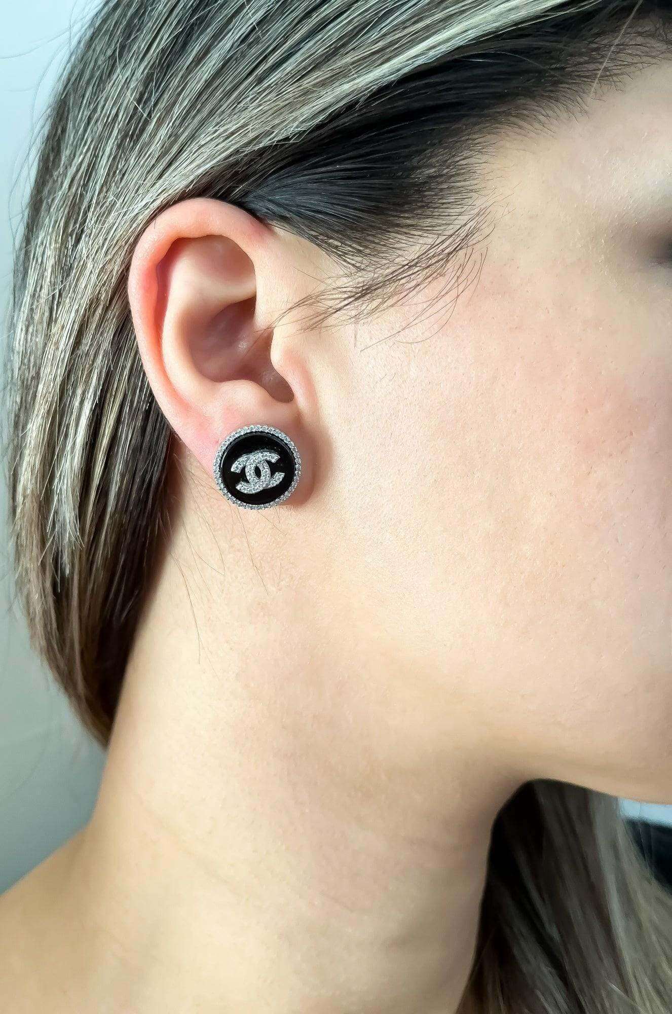 Vintage Chanel enamel 925 sterling silver earrings with black enamel and white zircon baguette stones on ear