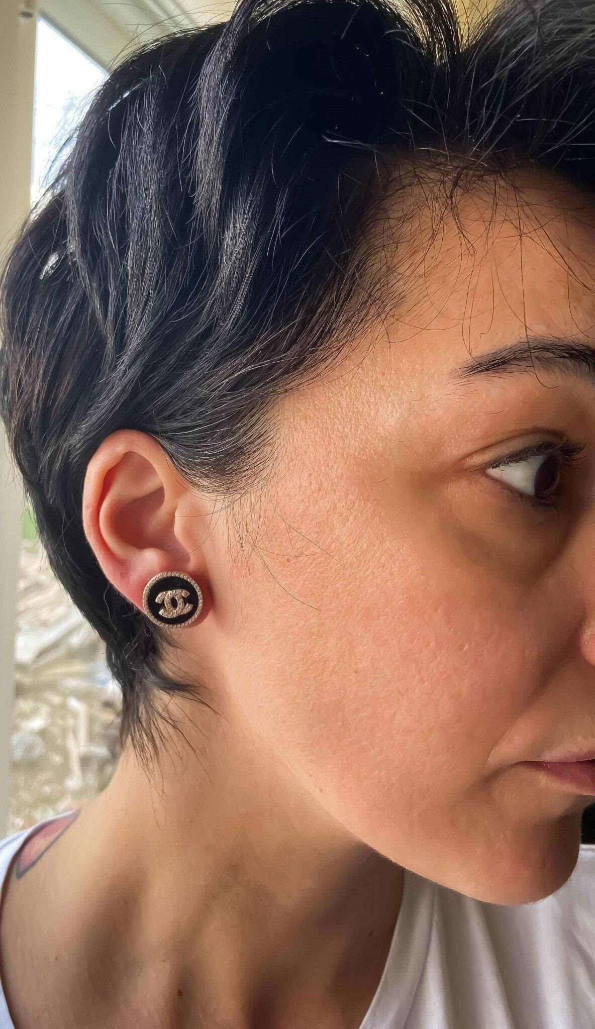 Enamel Chanel vintage rose gold earrings with sterling silver and baguette stones worn on ear