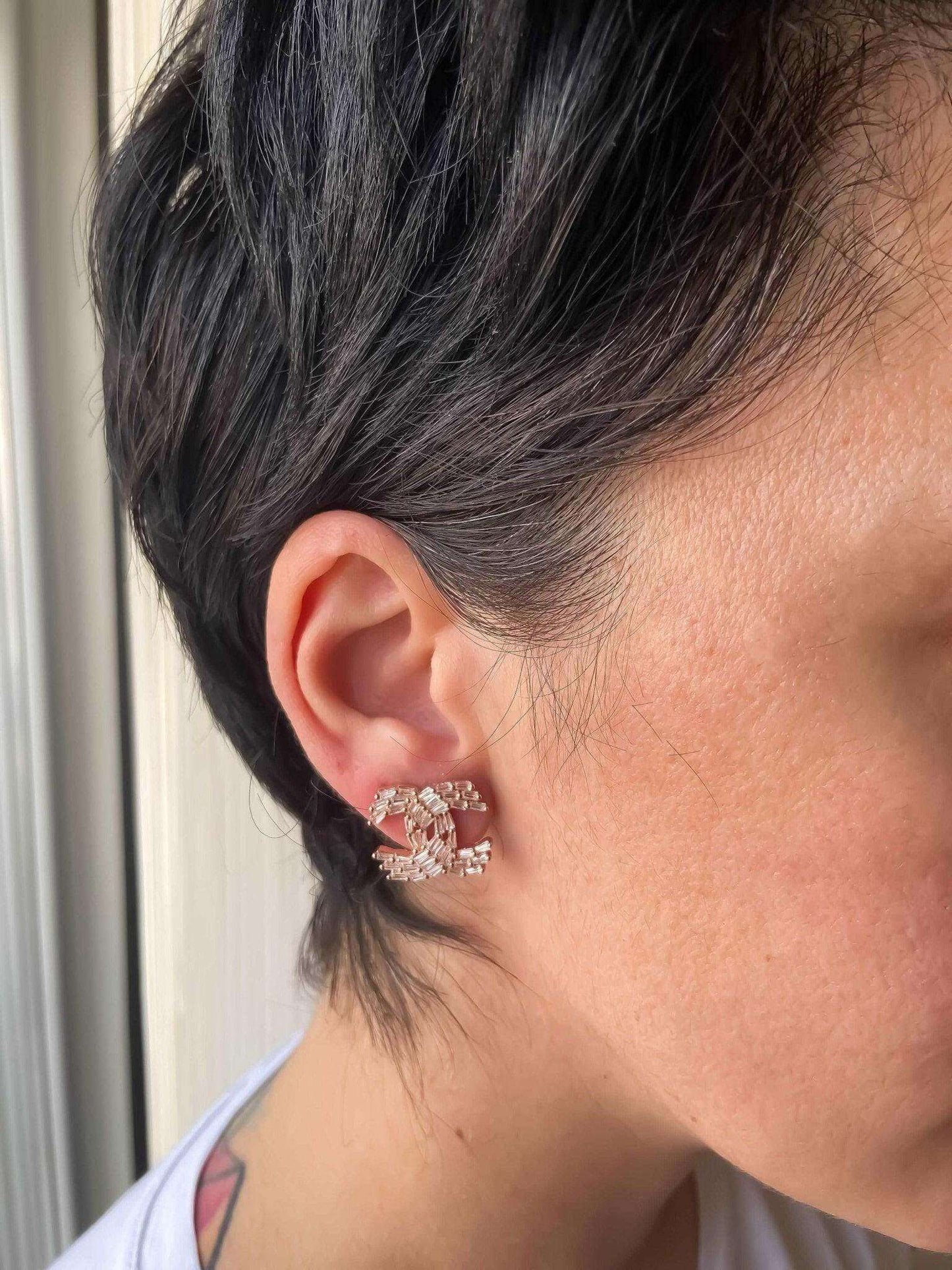 Chanel Rose Gold stud earrings with baguette stones in 925 sterling silver worn on ear