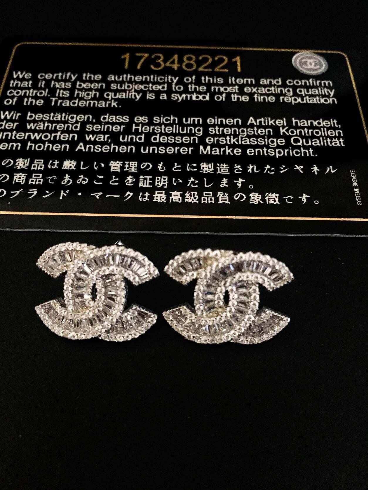 Authentic Chanel 925 sterling silver earrings with zircon stones and certification card