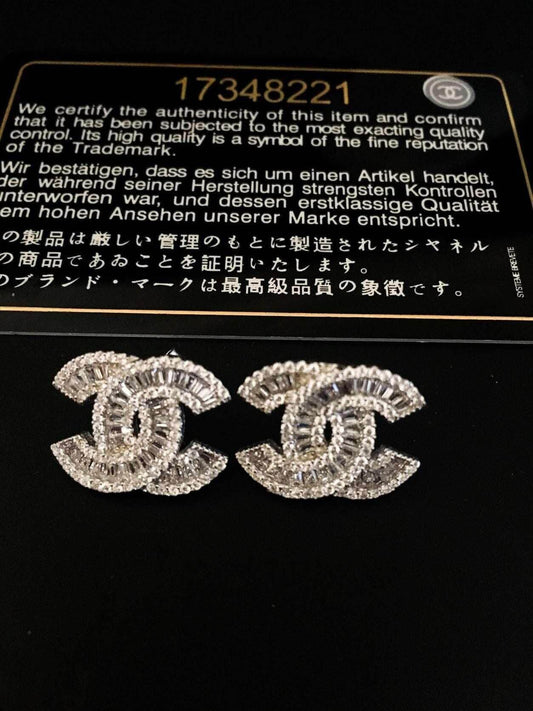 Authentic Chanel 925 sterling silver earrings with zircon stones and certification card
