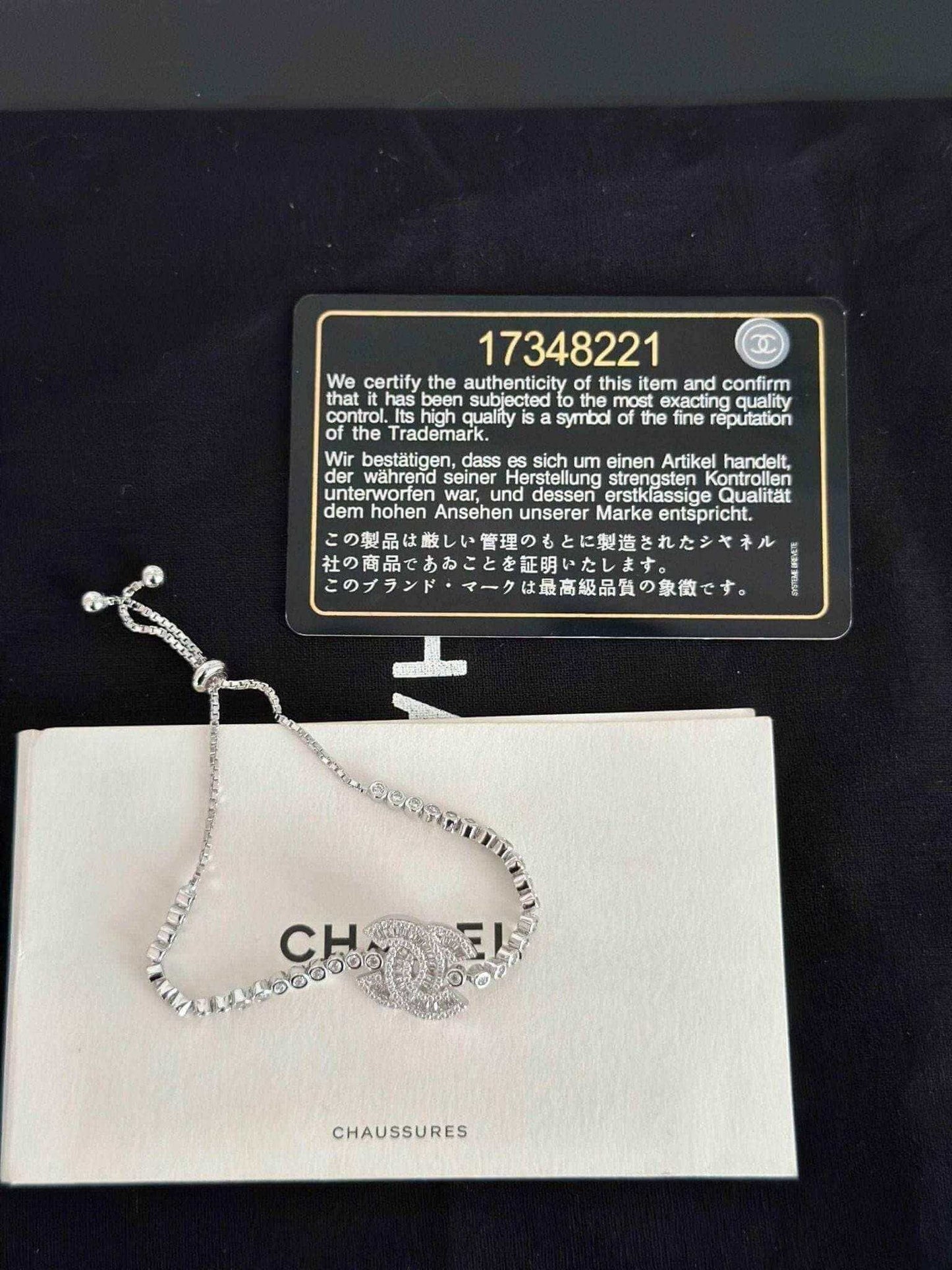 Exquisite 925 Sterling Silver Chanel Bracelet with Brilliant White Zircon Stone - Timeless Elegance displayed on black background.