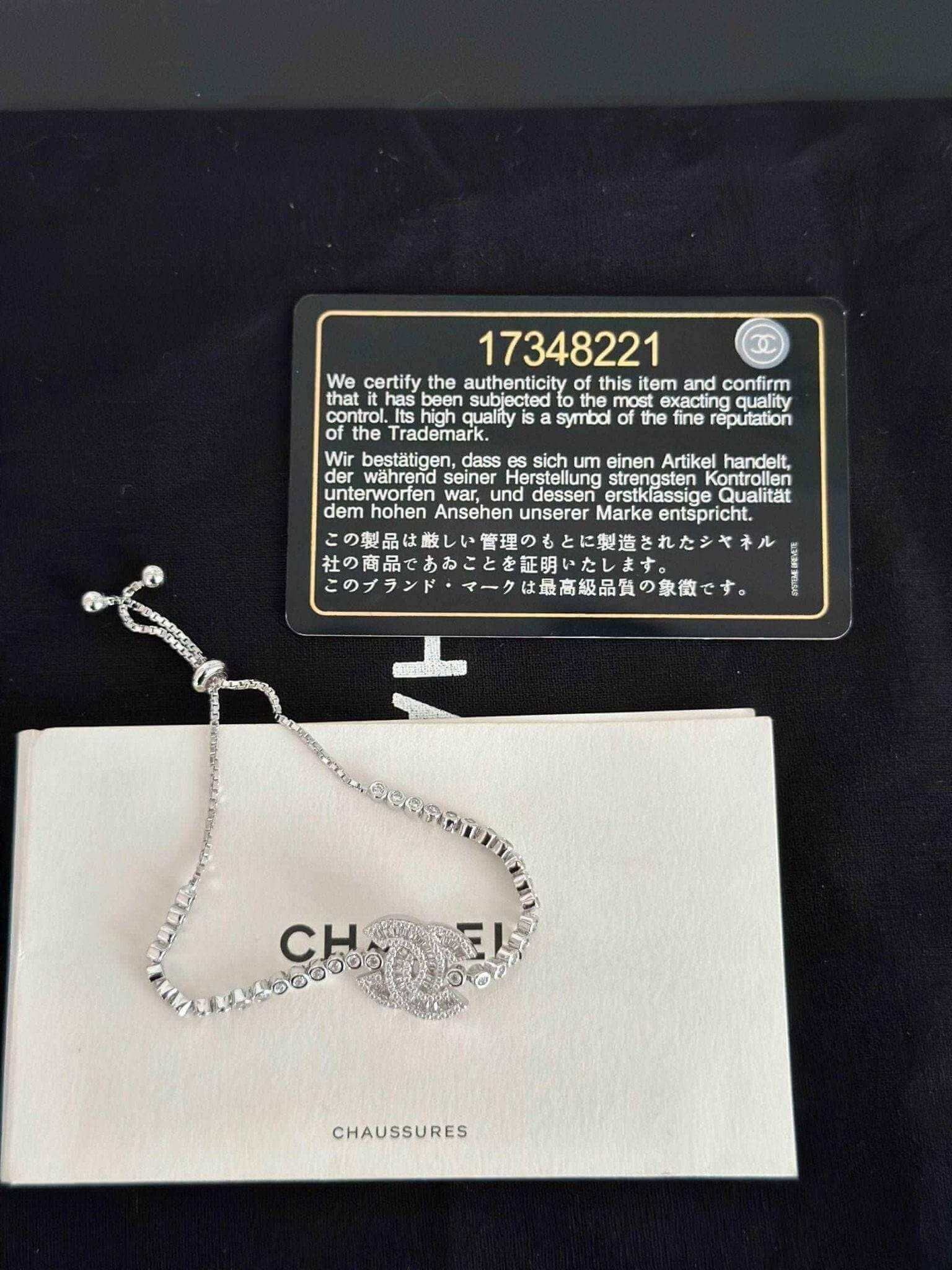 Exquisite 925 Sterling Silver Chanel Bracelet with Brilliant White Zircon Stone - Timeless Elegance displayed on black background.