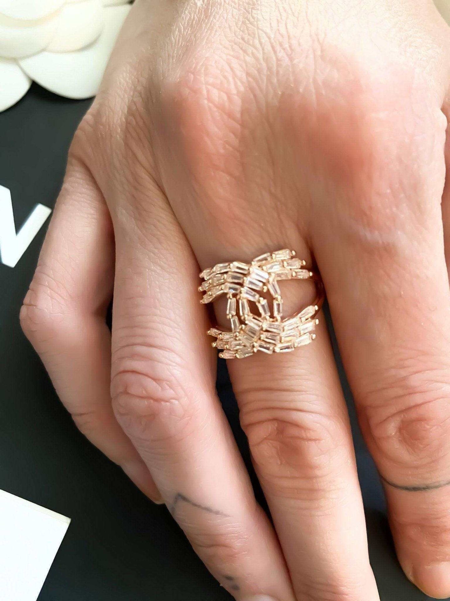 Vintage Chanel rose gold ring with baguette stones in 925 sterling silver on hand