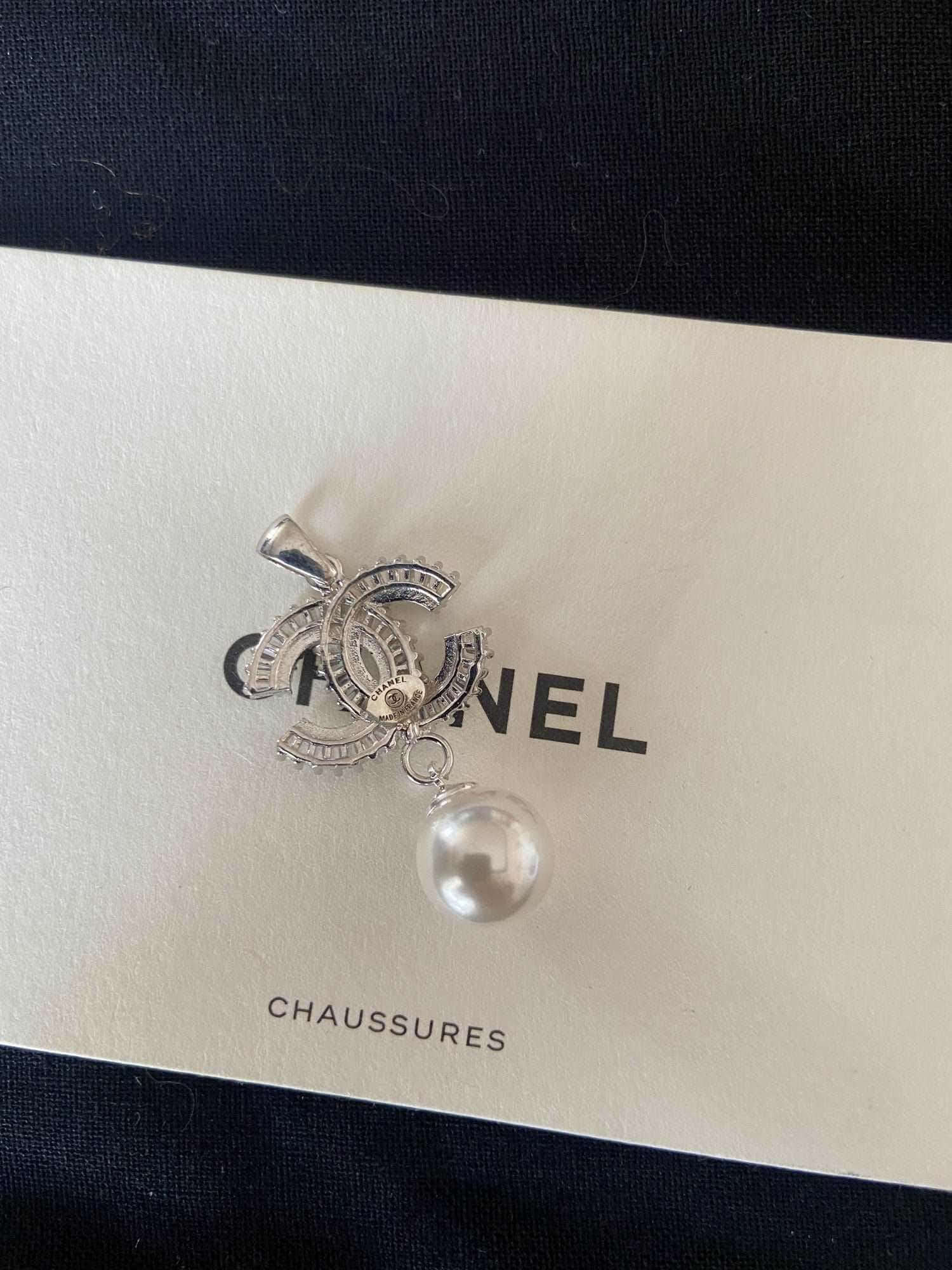 Authentic Chanel Jewelry 925 sterling silver necklace with pearl and baguette stones on Chanel box