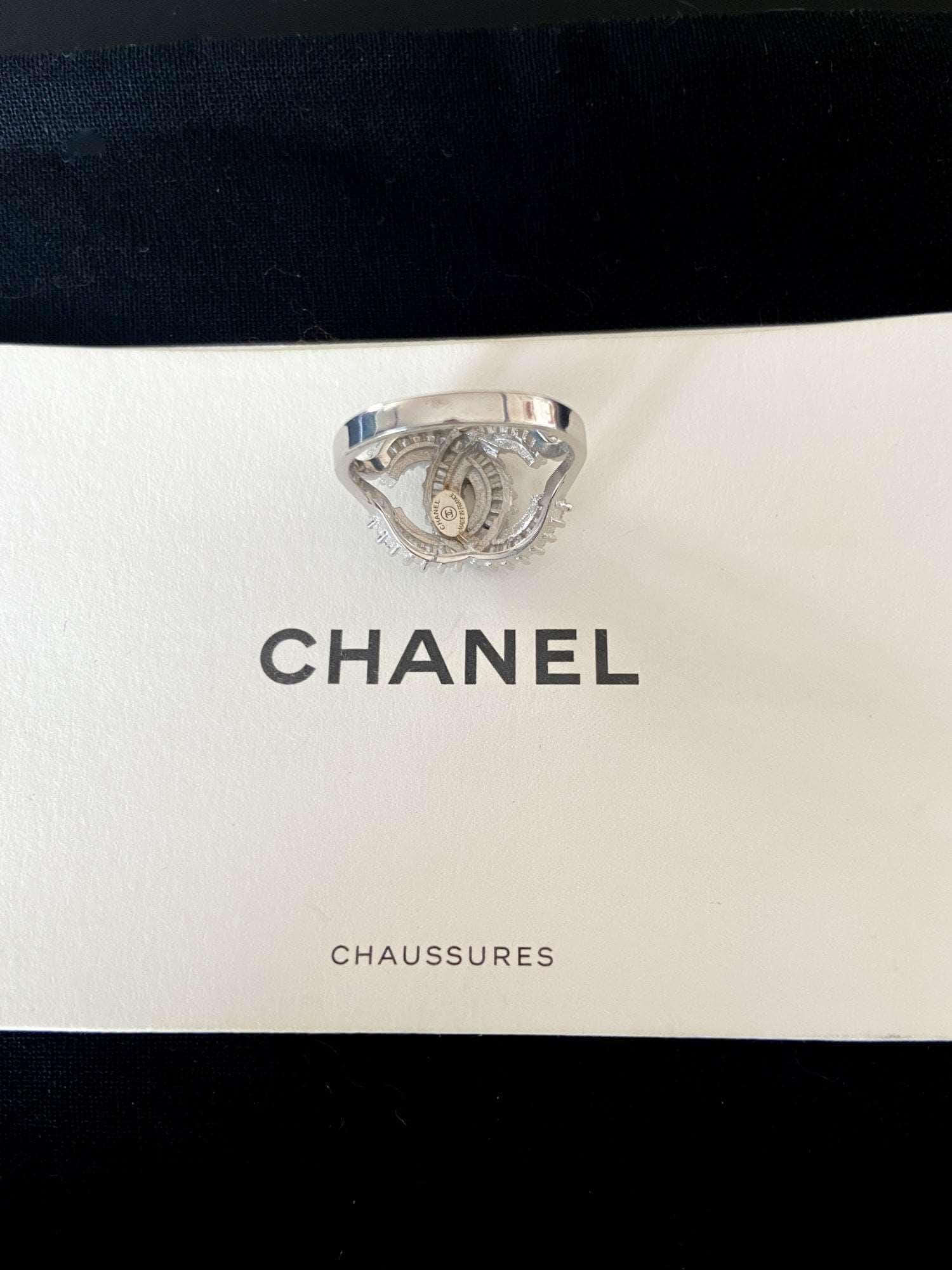 Authentic Chanel ring in 925 sterling silver with baguette white zircon stones on Chanel branded card