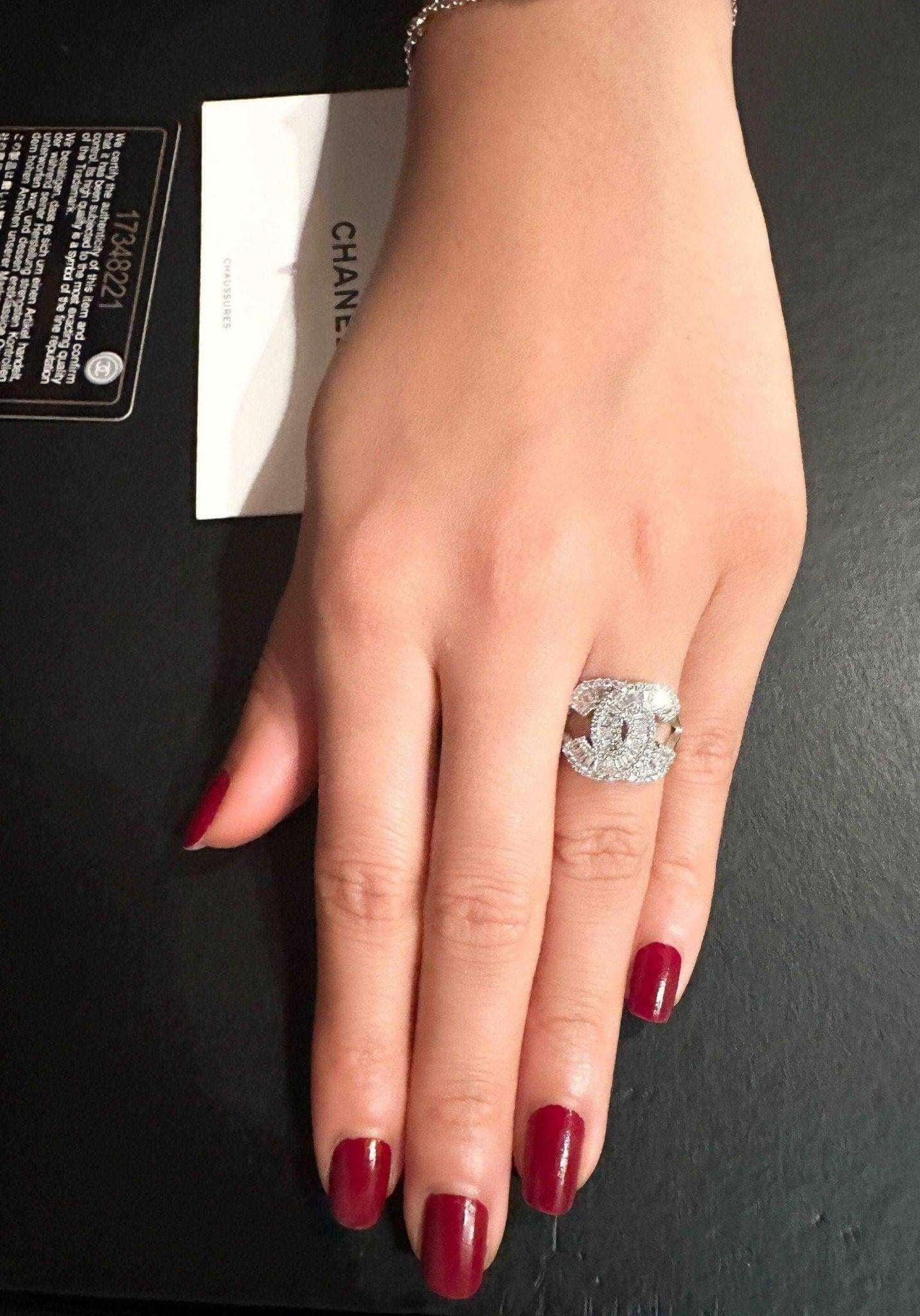 Authentic Chanel ring in 925 sterling silver with baguette white zircon stones on hand