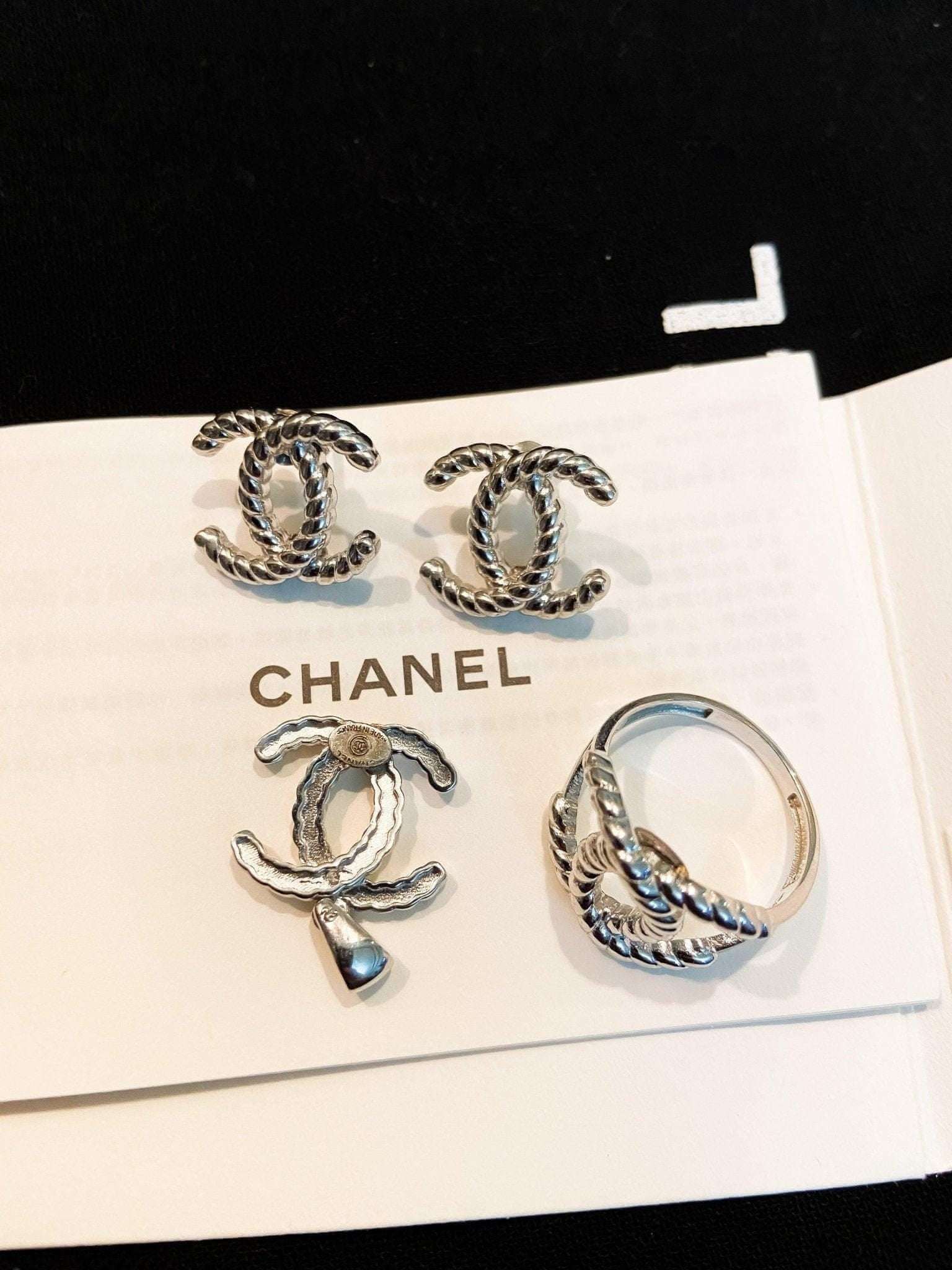 Vintage Chanel Set 925 sterling silver earrings and ring with twisted design on Chanel card