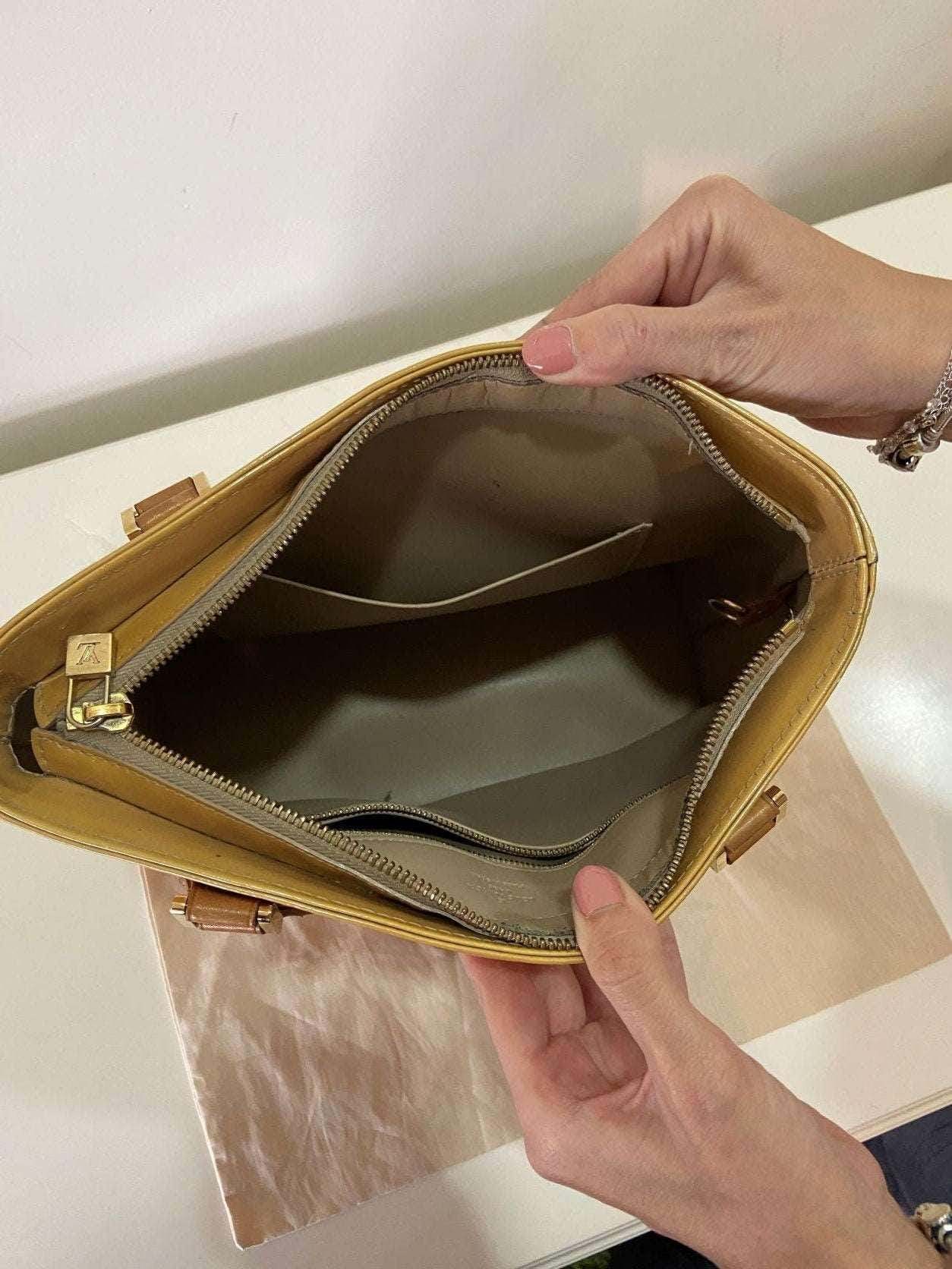 Louis Vuitton Vernis Houston yellow handbag interior view with zipper and pocket compartments