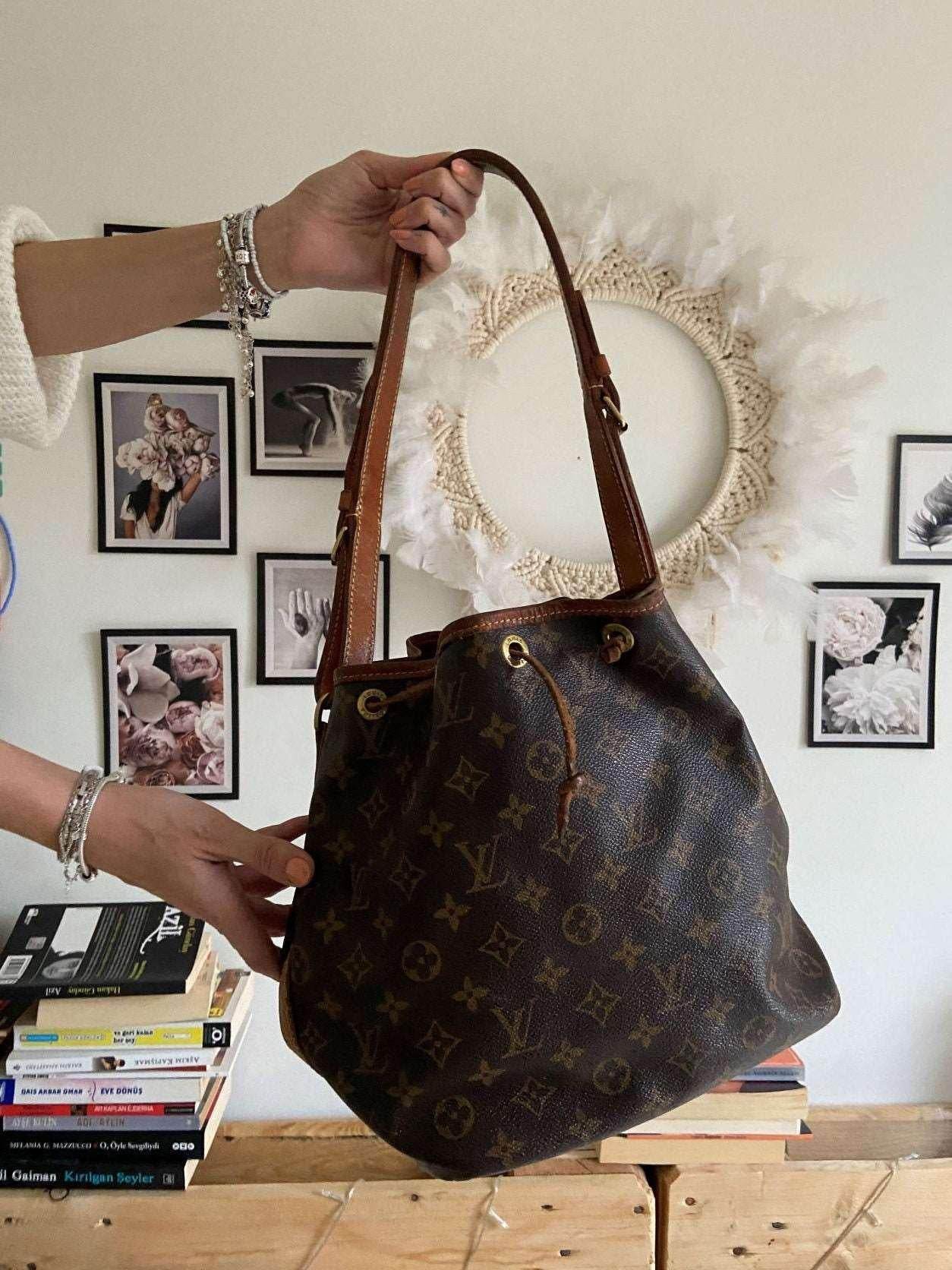 Authentic Louis Vuitton Noe Monogram shoulder bag vintage style with monogram canvas and leather straps