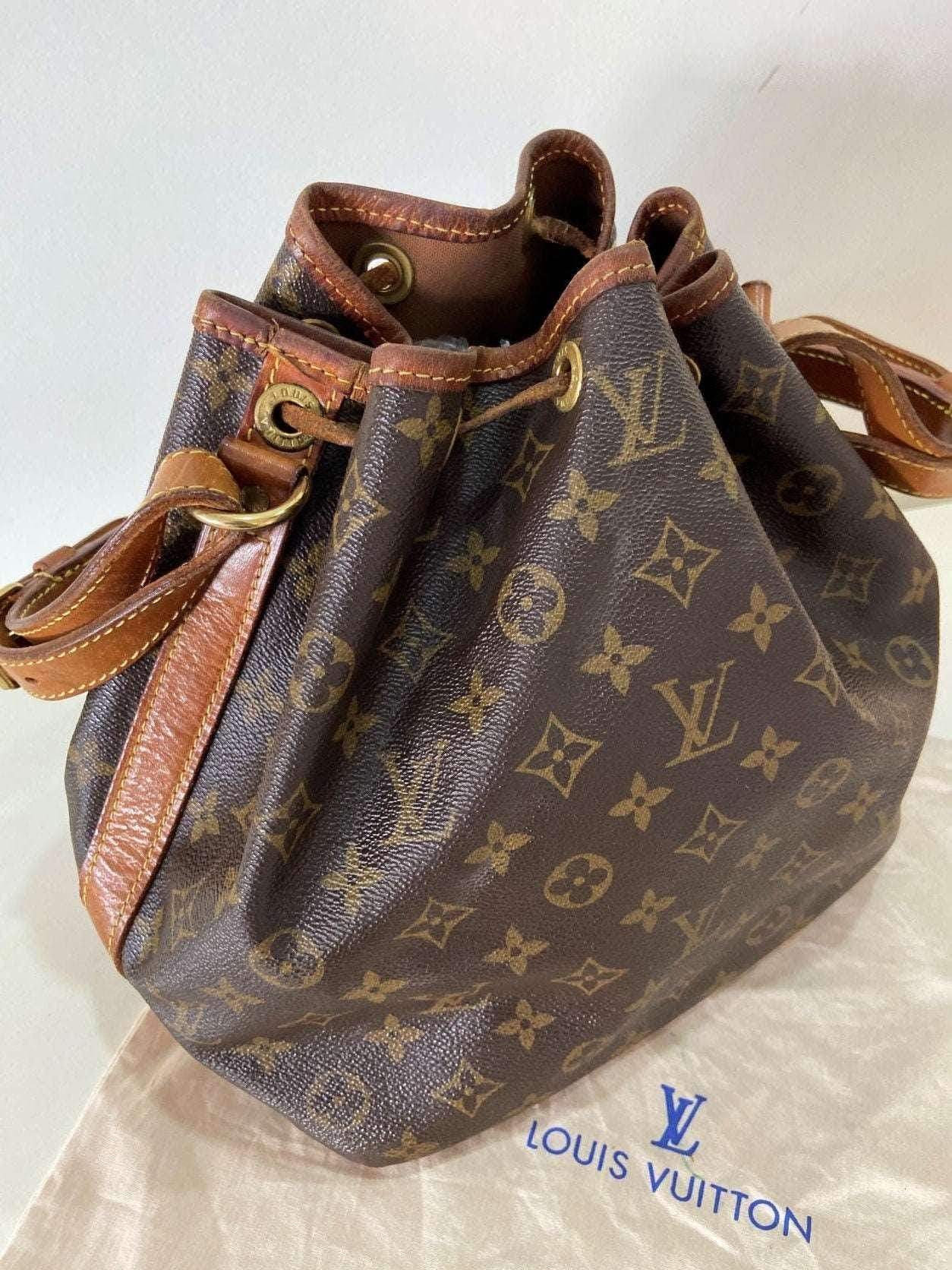 Louis Vuitton Noe bag vintage monogram shoulder bag with leather trim and drawstring closure