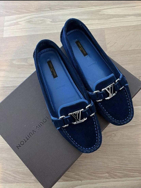 Louis Vuitton women's royal blue suede loafers with gold initials on a Louis Vuitton box