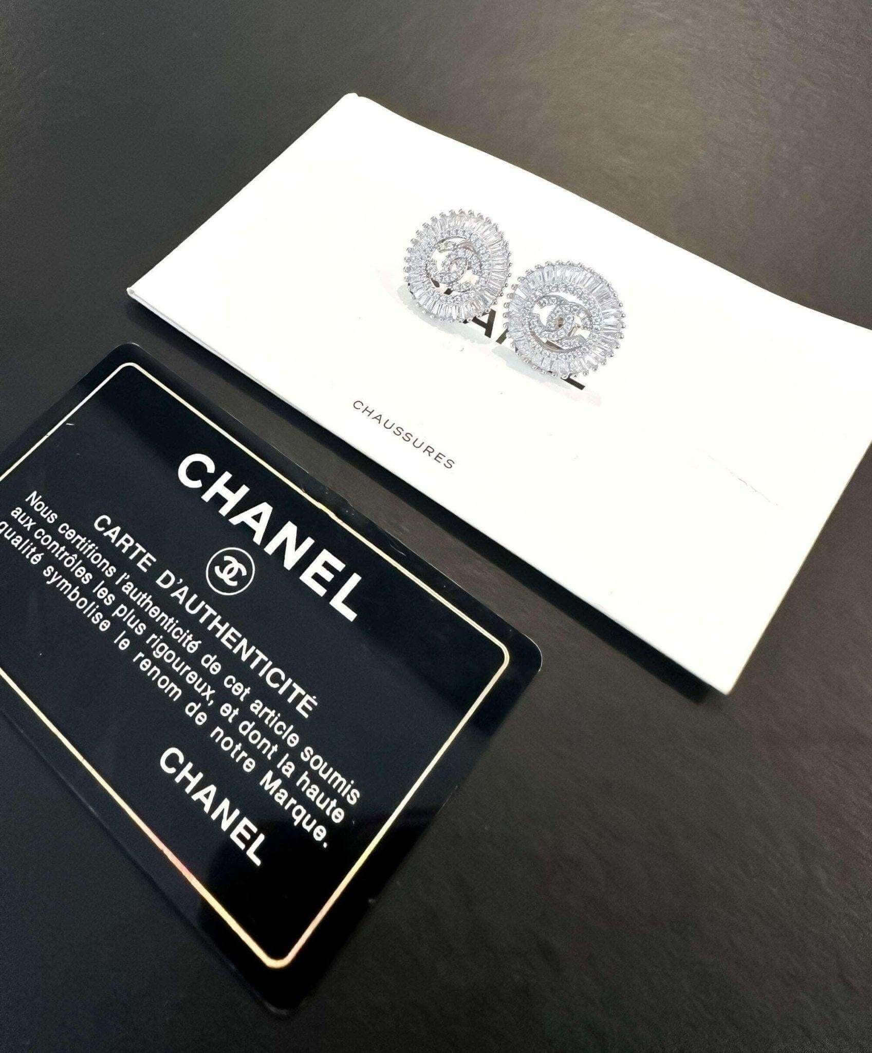 Authentic Chanel Jewelry 925 sterling silver earrings with baguette stones and authenticity card