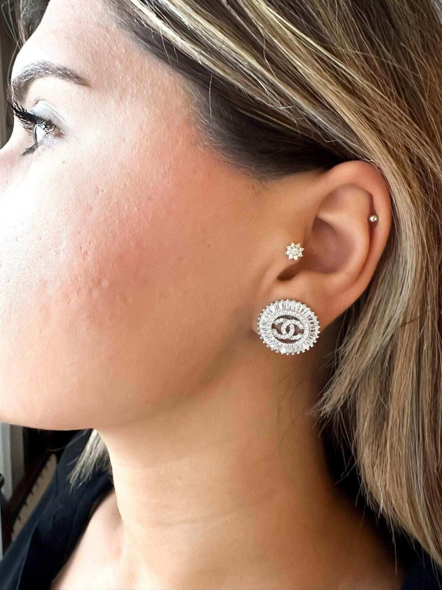Authentic Chanel Jewelry 925 sterling silver earrings with baguette stones on woman's ear