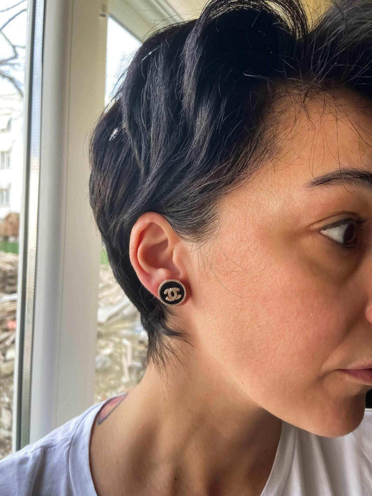 Enamel Chanel vintage rose gold earrings on woman with short hair