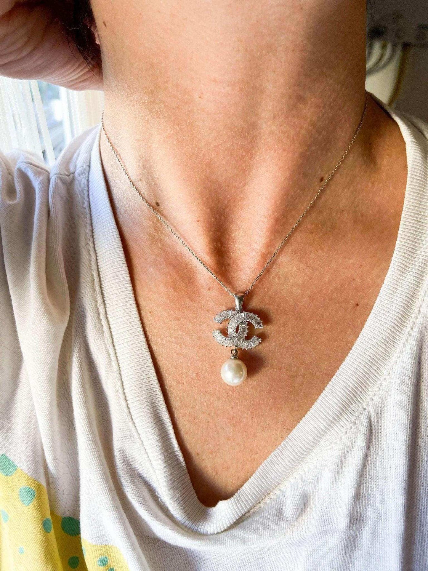 Authentic Chanel Jewelry 925 sterling silver necklace with pearl and baguette stones worn on neck