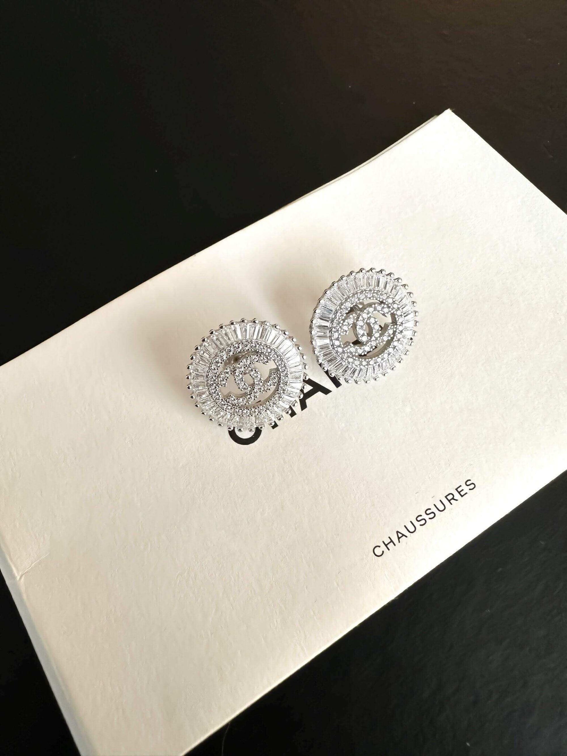 925 sterling silver Chanel earrings with zircon stones and baguette design on white box