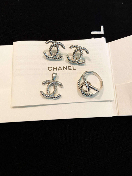 Vintage Chanel set 925 sterling silver earrings, pendant, and ring jewelry set on white card