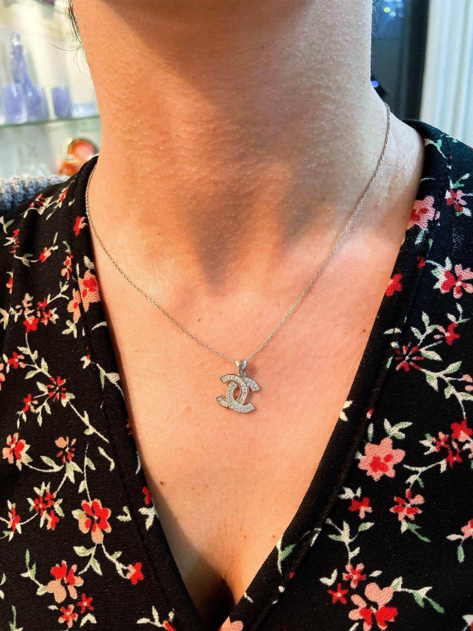 Chanel Jewelry 925 sterling silver necklace with baguette stones worn on neck