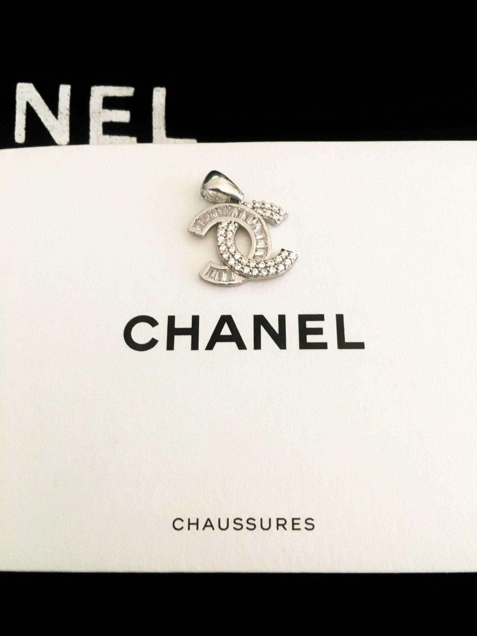 Chanel Jewelry 925 sterling silver pendant with baguette stones on Chanel box