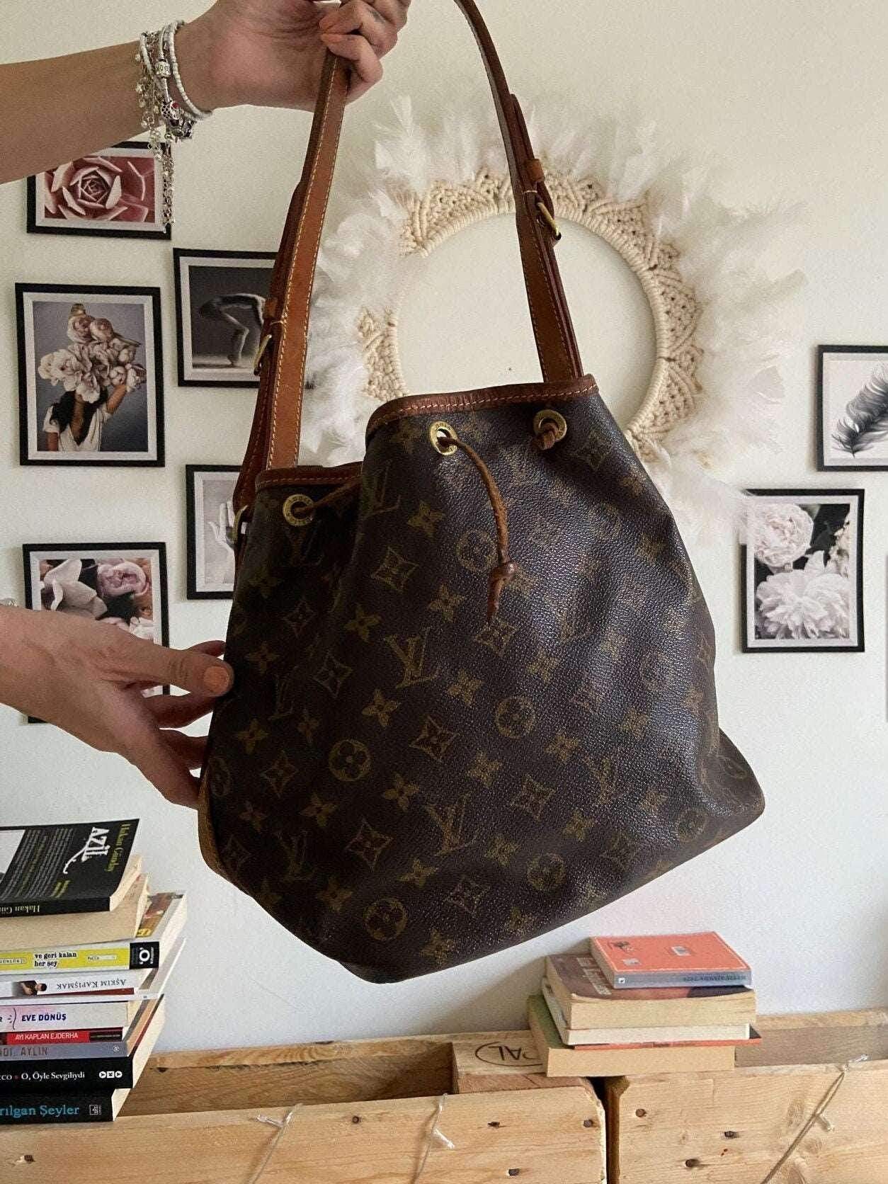 Authentic Louis Vuitton Noe bag with monogram canvas and brown leather straps, vintage shoulder bag in good condition