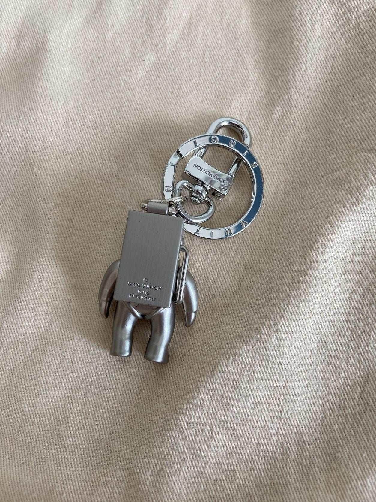 Silver Louis Vuitton Astronaut Keychain MP2213 with original box, vintage condition