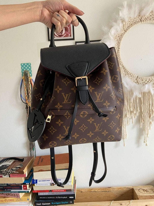 Louis Vuitton Monogram MONTSOURIS Backpack in brown monogram canvas with black leather flap and gold buckle