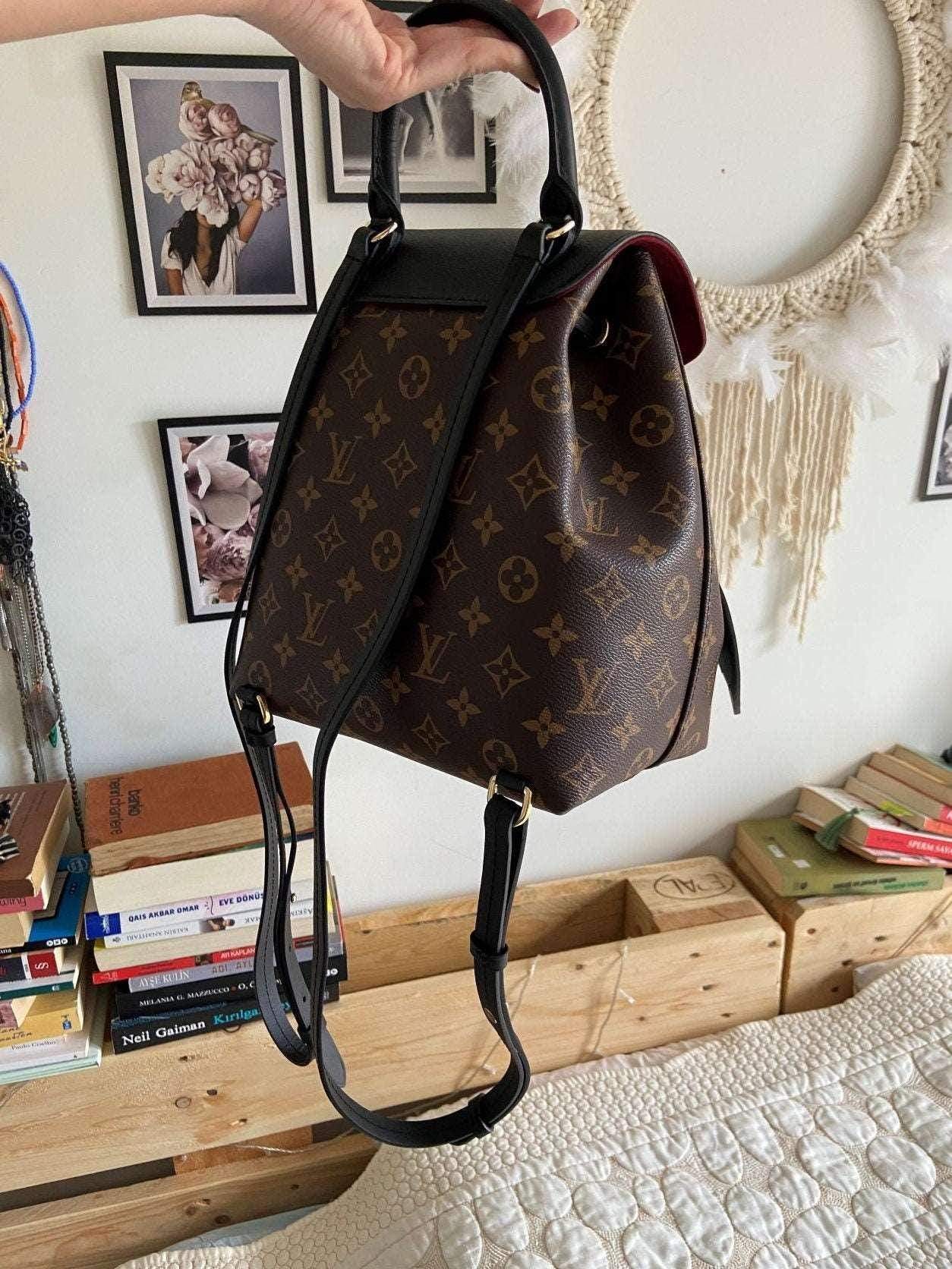 Louis Vuitton Monogram MONTSOURIS Backpack in brown with black straps and iconic LV pattern