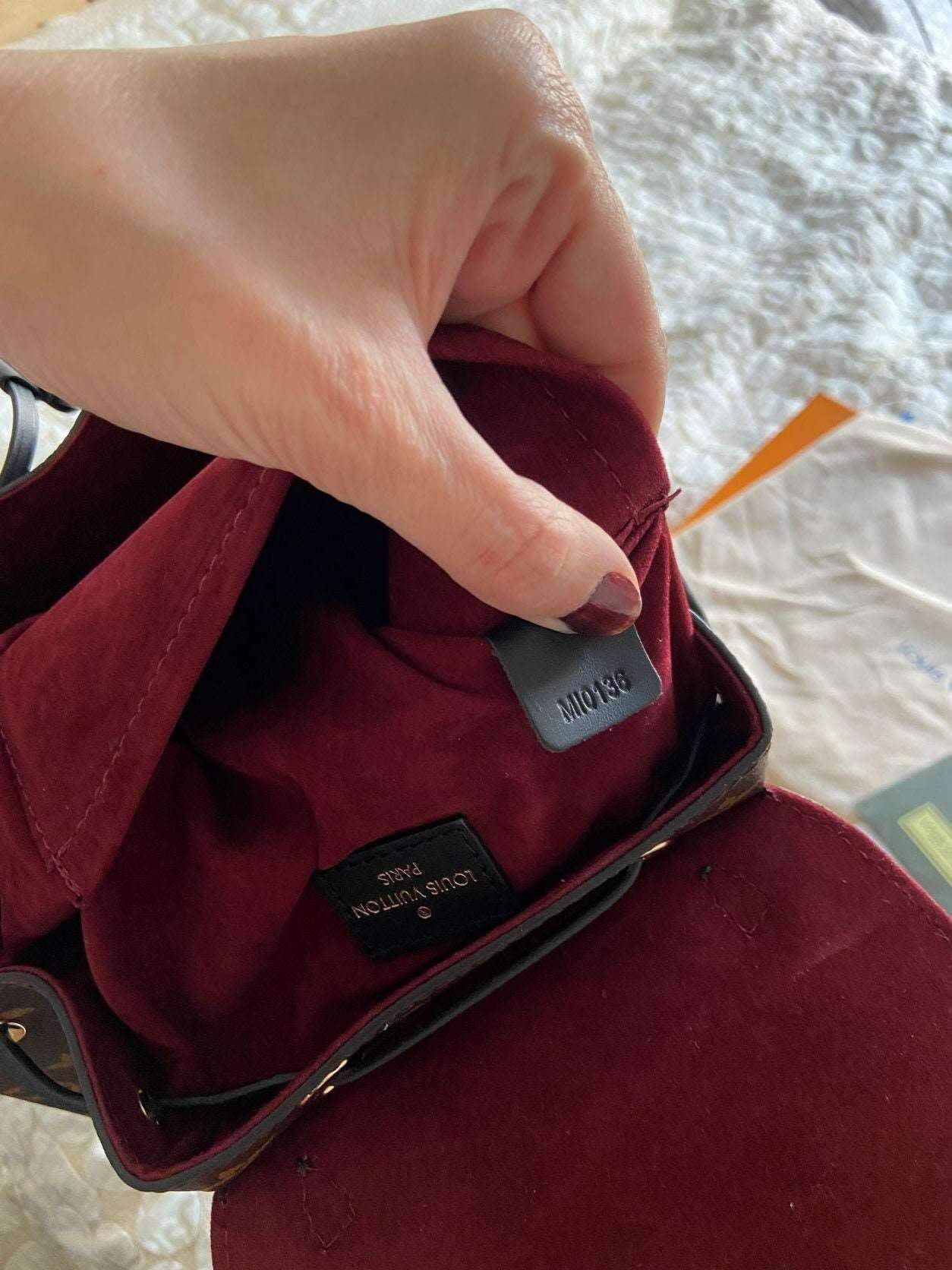 Louis Vuitton Monogram MONTSOURIS Backpack interior with burgundy lining and authenticity label